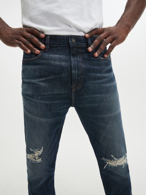 Globetrotter Guess بنطلون جينز ممزق مستدق